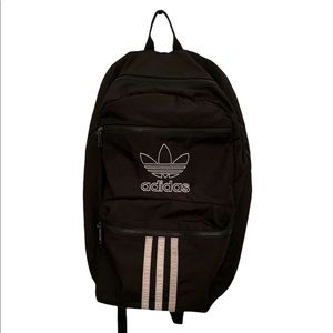 Black Adidas book bag with 6 big pockets, rarely used.